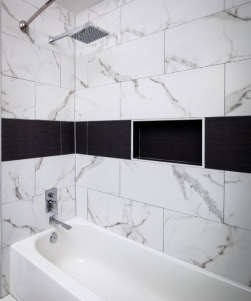 Tiled bathtub and shower at Melrose in Houston, Texas