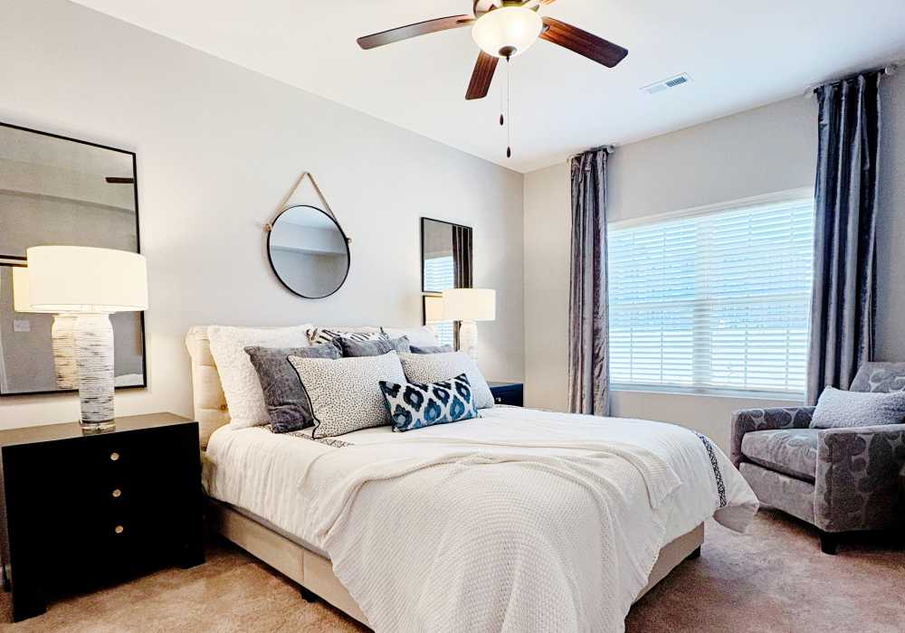 Spacious bedroom with lots of natural light at Carroll at Cane Ridge Apartments in Antioch, Tennessee