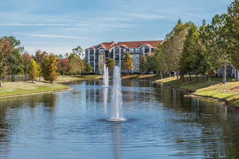 Exterior complex view with fountain on the water at The Aspect in Kissimmee, Florida