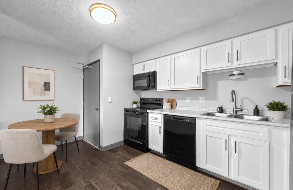 Kitchen with white color cabinets at Eastwood on Grand in West Des Moines, Iowa 