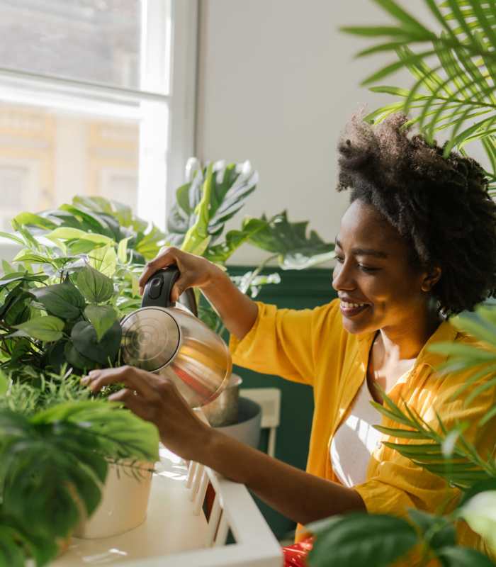 Resident gardening her plants at Anchor Apartments in Freeport, FL
