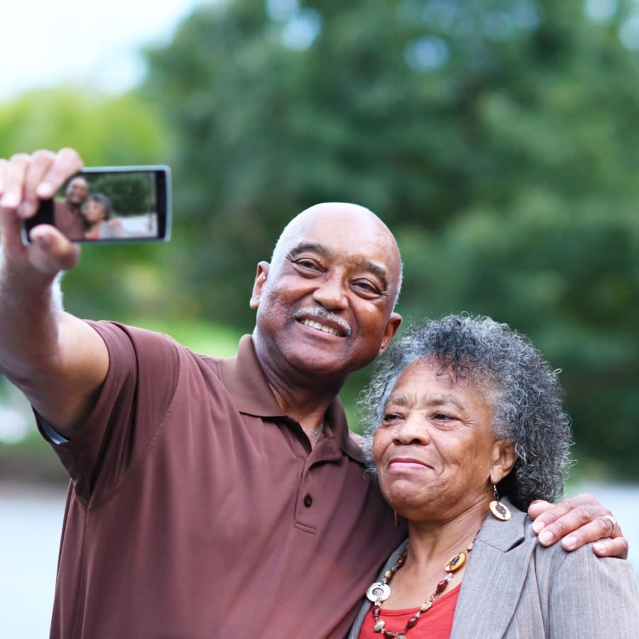 Happy residents taking a photo together near Indigo Ridge in New Bern, North Carolina