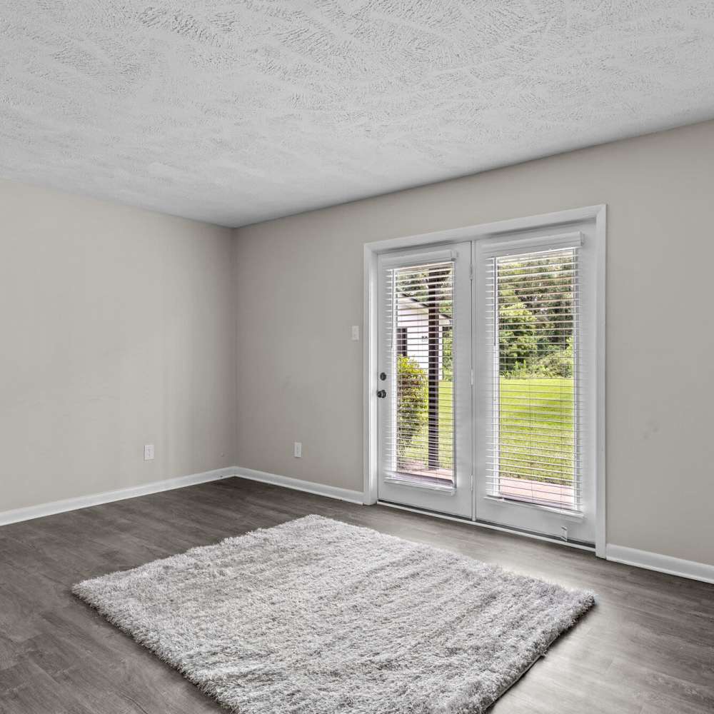 Living room with balcony access at Commodore in Vicksburg, Mississippi