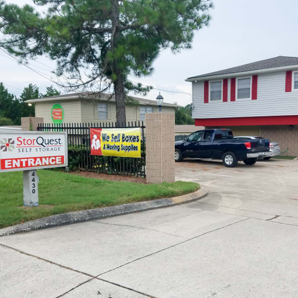 Main sign at the entrance of StorQuest Self Storage in Gainesville, Florida