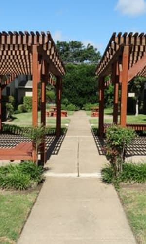 Walking path and landscaped courtyard at Crystal Ridge in Midlothian, Texas