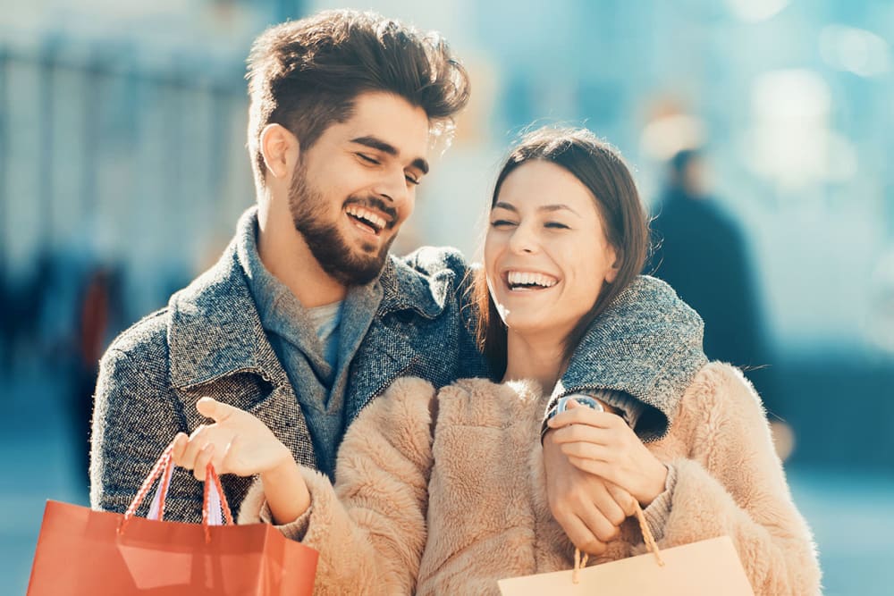 Resident couple laughing and out shopping together near Everwood at The Avenue in Murfreesboro, Tennessee