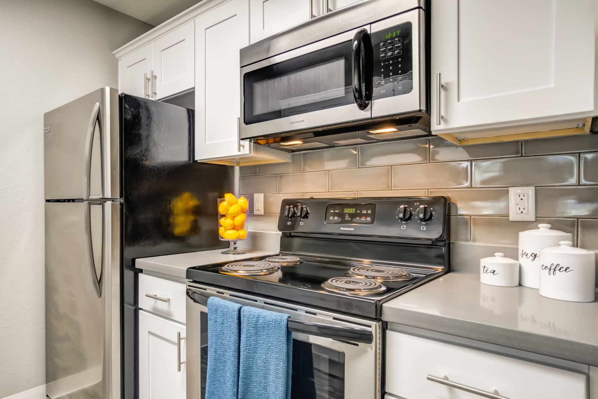 A kitchen, with tile backsplash at Serramonte Ridge Apartment Homes in Daly City, California