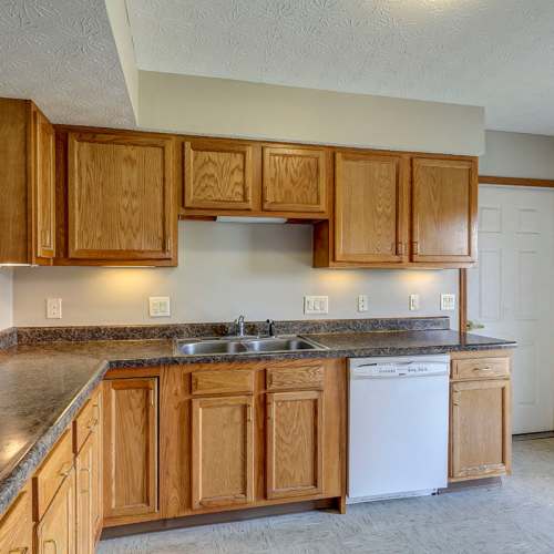 Wooden cabinets with countertop and sink at Orchard Glen in Orrville, Ohio