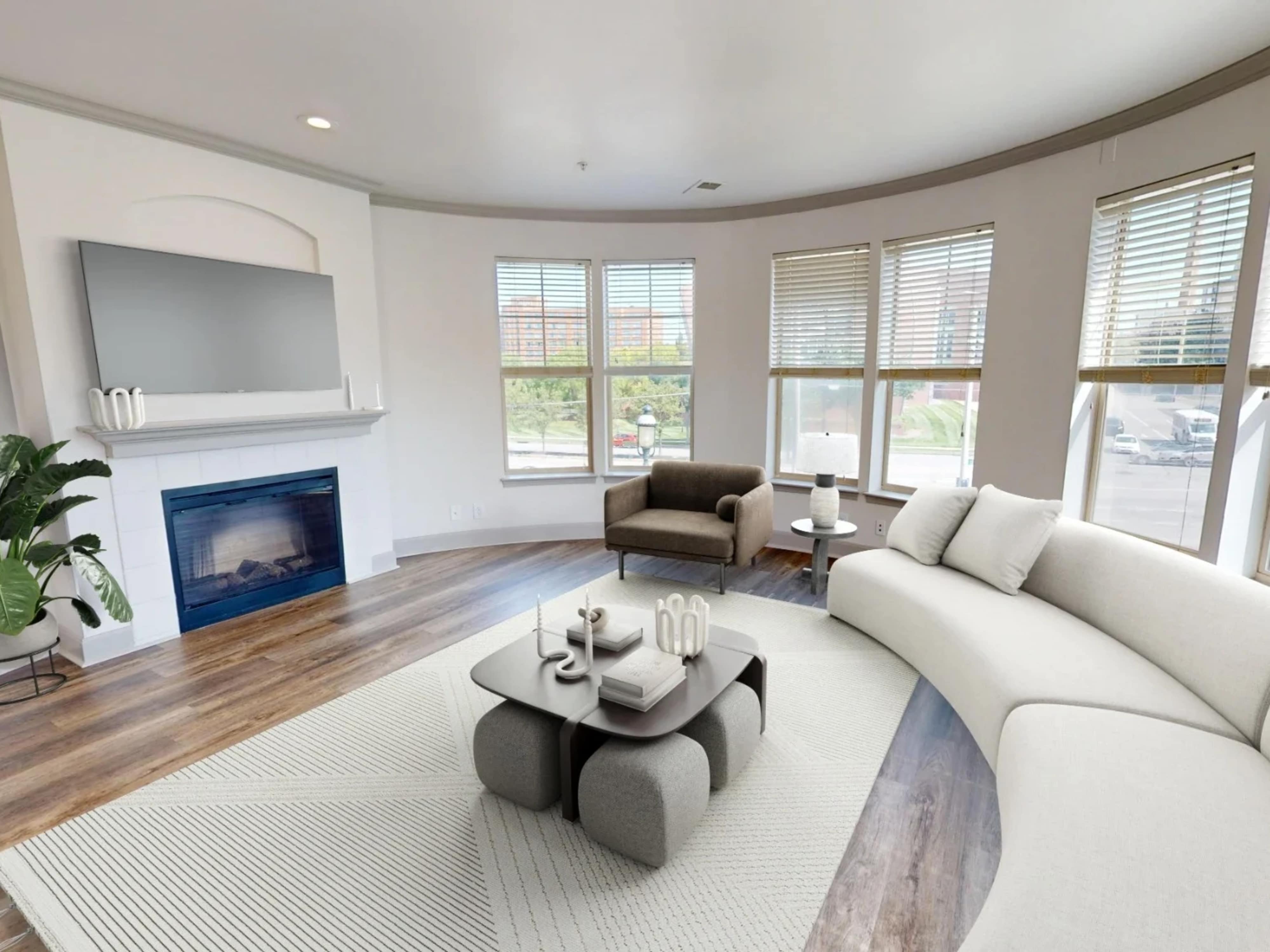 Beautiful living room with fireplace at The Village at Stetson Square in Cincinnati, Ohio
