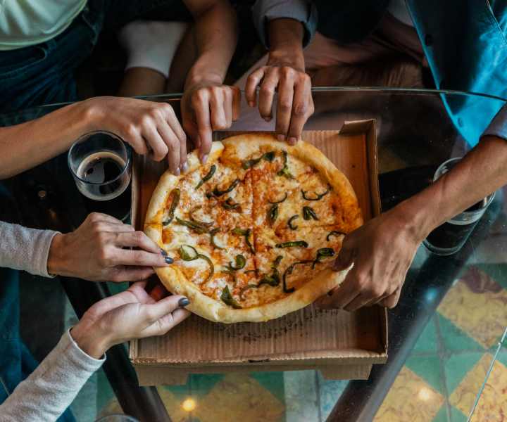 Resident enjoying pizza near Fairview Crossing in Scottsburg, Indiana