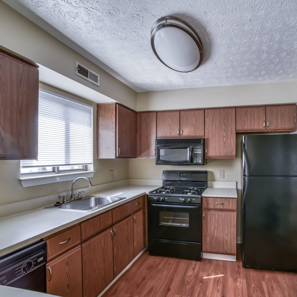 Kitchen with wood-style flooring at Ravenna Woods, Twinsburg, Ohio