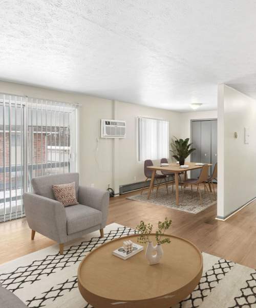 Living room with cozy seating and decor at Clarkwood Greens in Warrensville Heights, Ohio