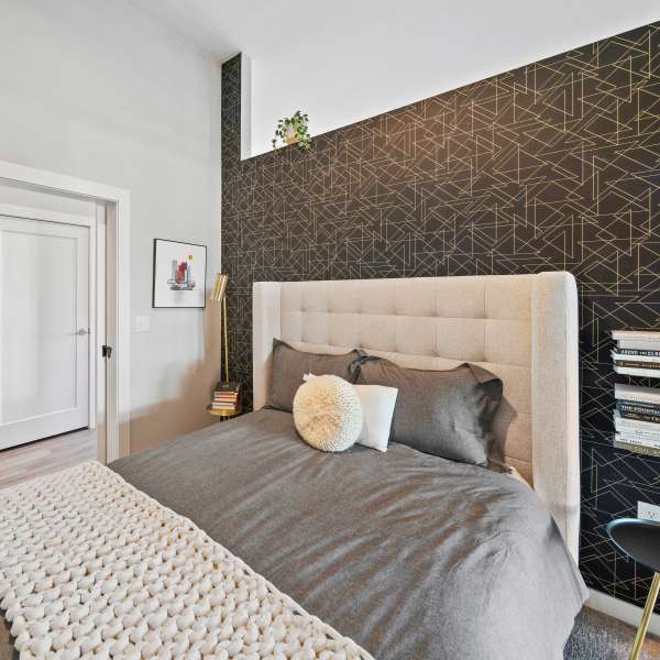 Full size bed with upholstered headboard at Jayne in Denver, Colorado