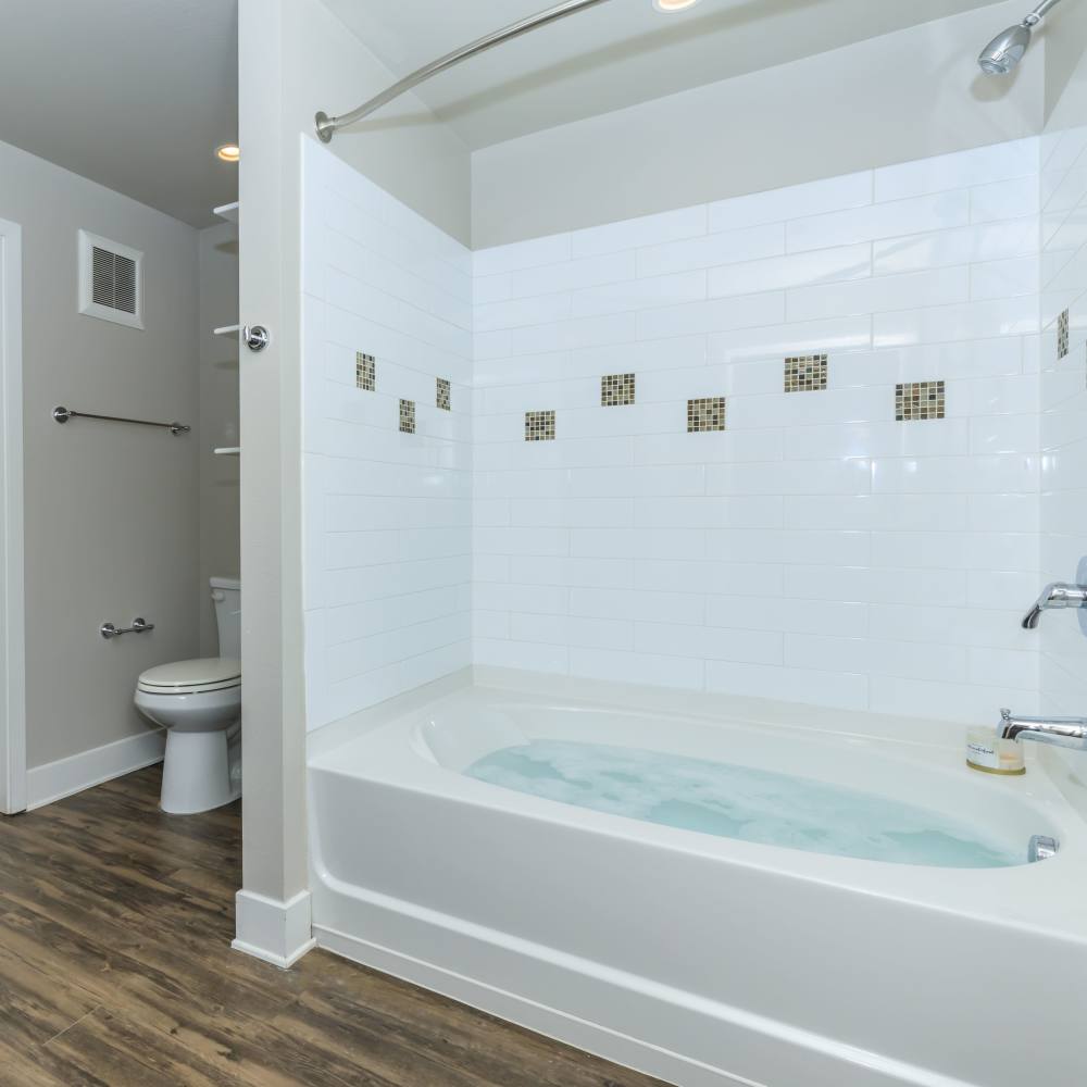 Bathroom with standard bathtub at Park Place Olde Town Apartments in Arvada, Colorado