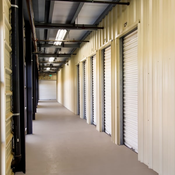 A row of indoor storage units at StorQuest Self Storage in Ceres, California