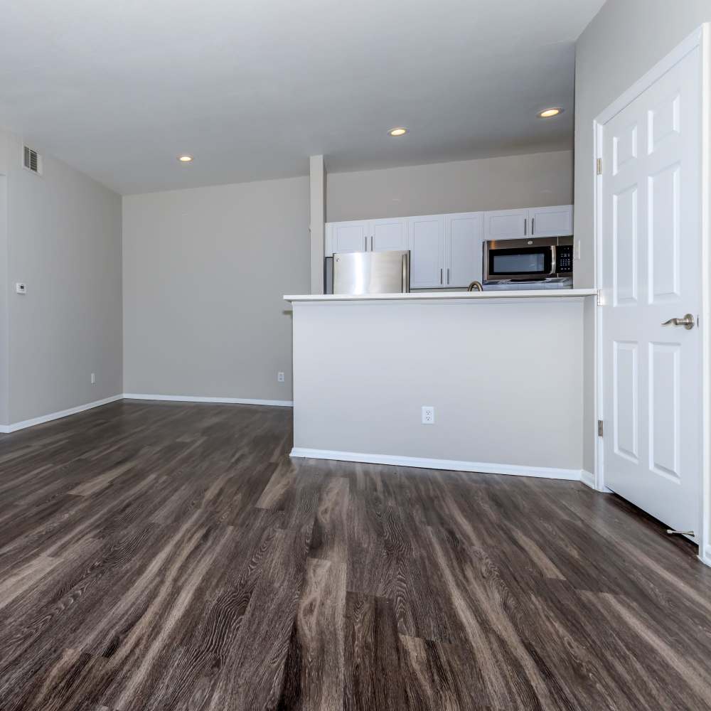 Open-concept of kitchen and living room at The Dakota at Governors Ranch in Littleton,Colorado