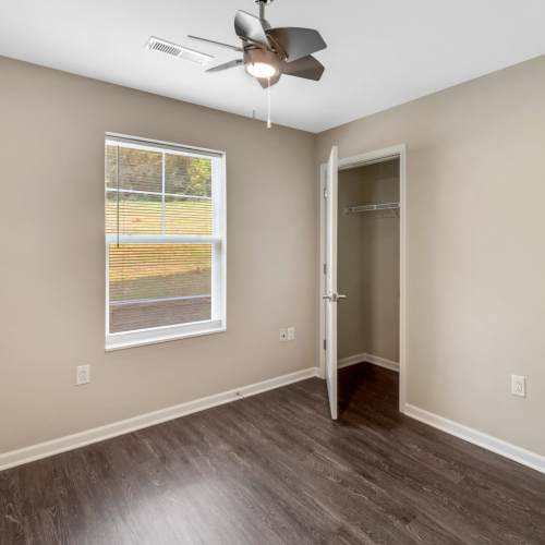 Bedroom with closet and ceiling fan at Magnolia Greene in Lavale, Maryland
