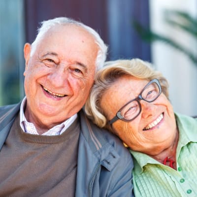 A happy resident couple smiling at Vintage Hills of Indianola in Indianola, Iowa