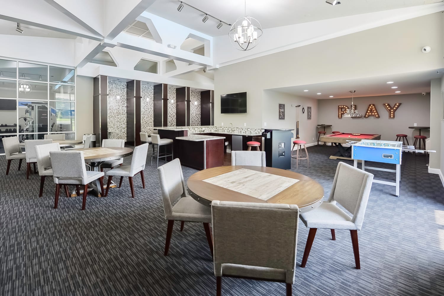 Resident clubhouse with a kitchen and billiards at Timberlake Apartment Homes in East Norriton, Pennsylvania