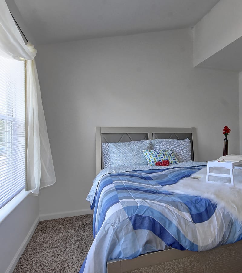 Bedroom with large windows and plush carpeting at Mariner's Watch in Norfolk, Virginia