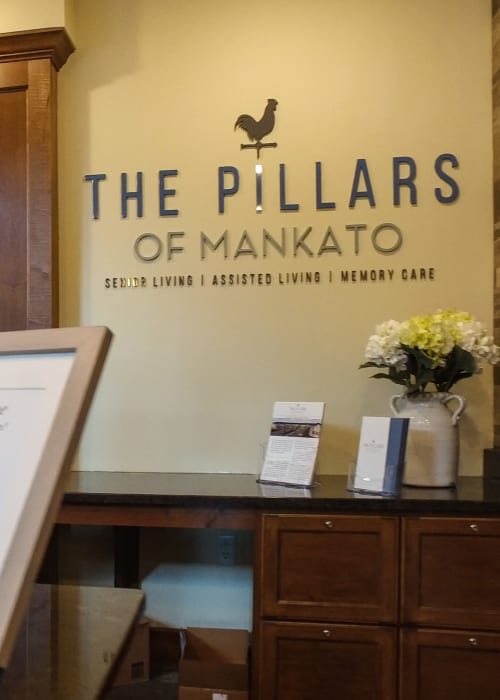 Main entrance with signage at The Pillars of Mankato in Mankato, Minnesota