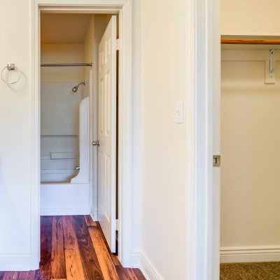 A closet adjacent to a bathroom in a home at O'Neill Heights in Oceanside, California