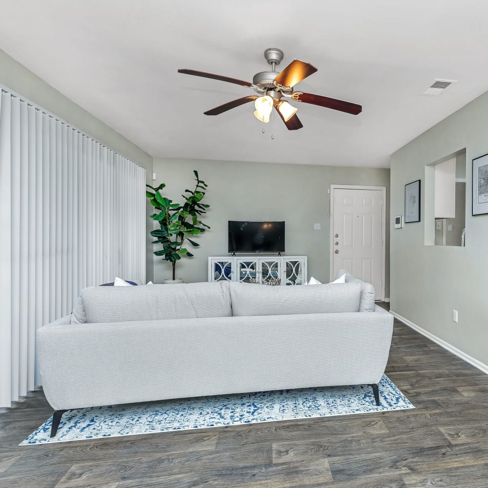 A large living room with patio access at Barringer Square in Webster, Texas