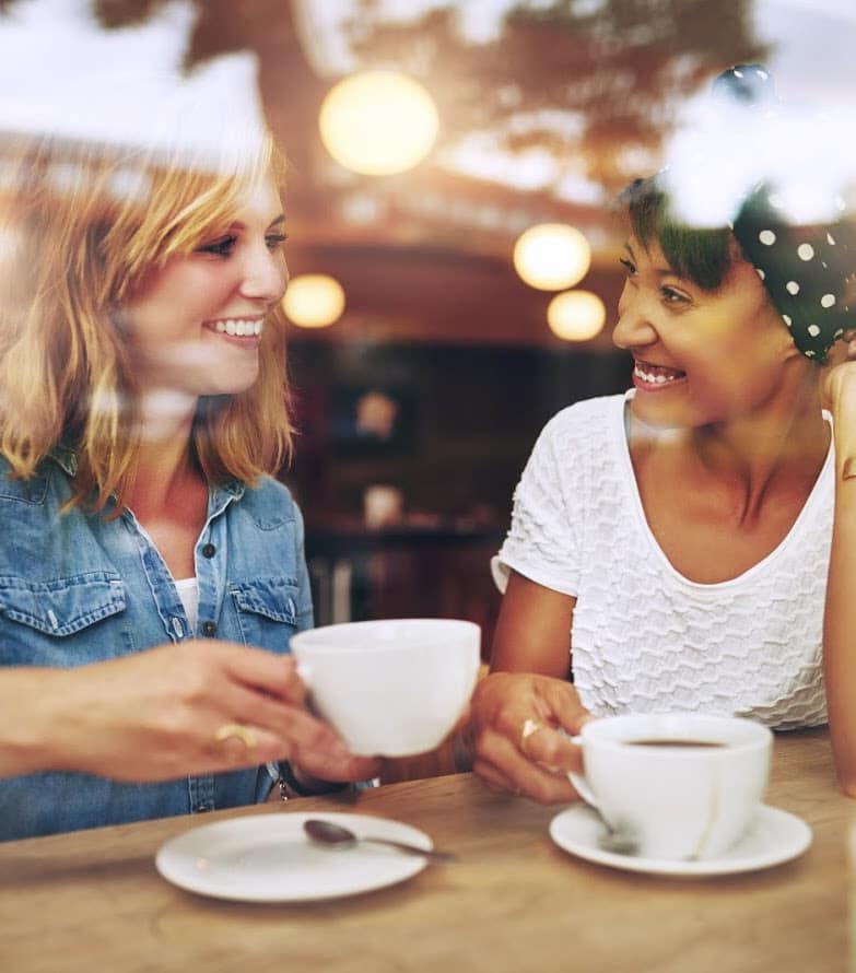 Friends having coffee together at River Oaks Apartment Homes in Vacaville, California