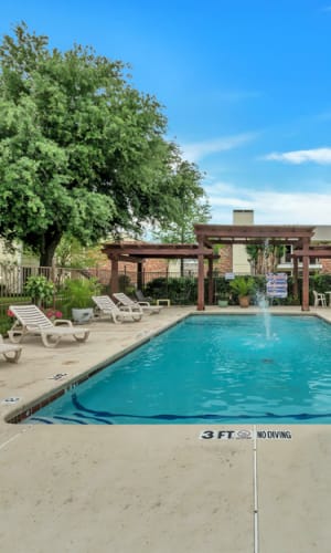 Serene swimming pool at Stonegate Apartments in Mckinney, Texas