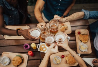 A group of residents cheers at a restaurant near Holland Park in Lawrenceville, Georgia