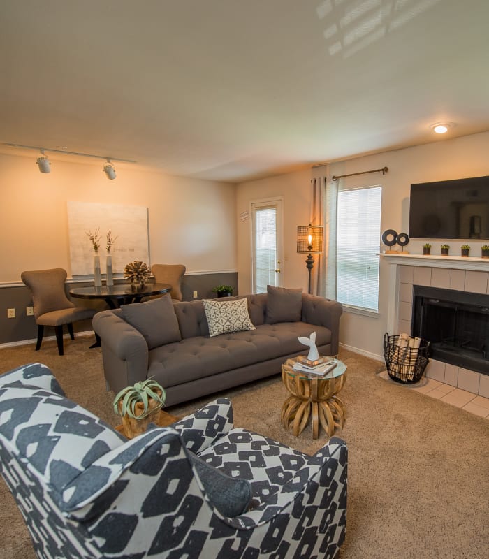 Carpeted living room at The Remington Apartments in Wichita, Kansas