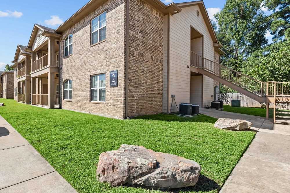 An apartments surrounded by greenery at Stonegate in Hallsville,Texas
