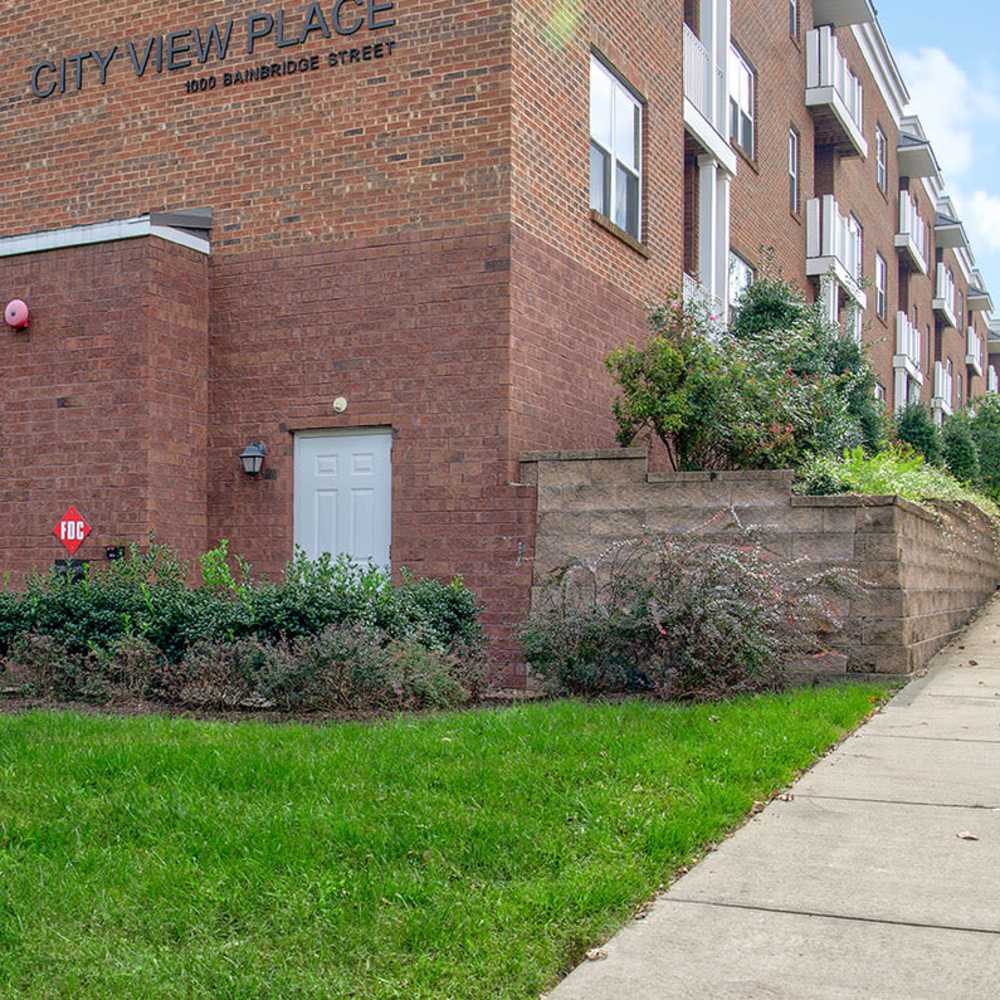 Building exterior with greenery all around at City View Place in Richmond, Virginia