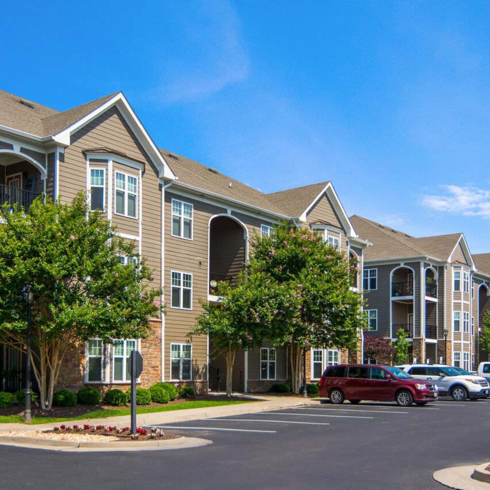 Apartment building exterior with parking at Waverly Place in Louisa, Virginia
