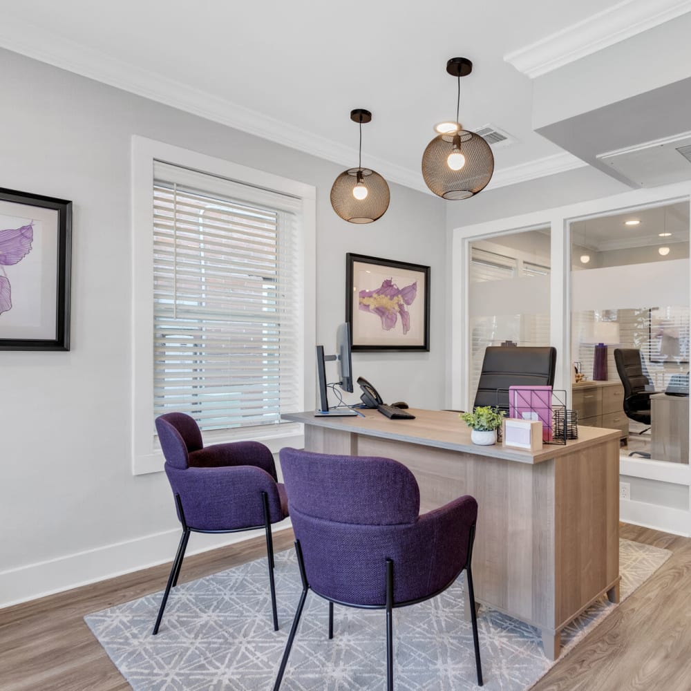 Office area with desk and two chairs at The Maxwell in Metairie, Louisiana