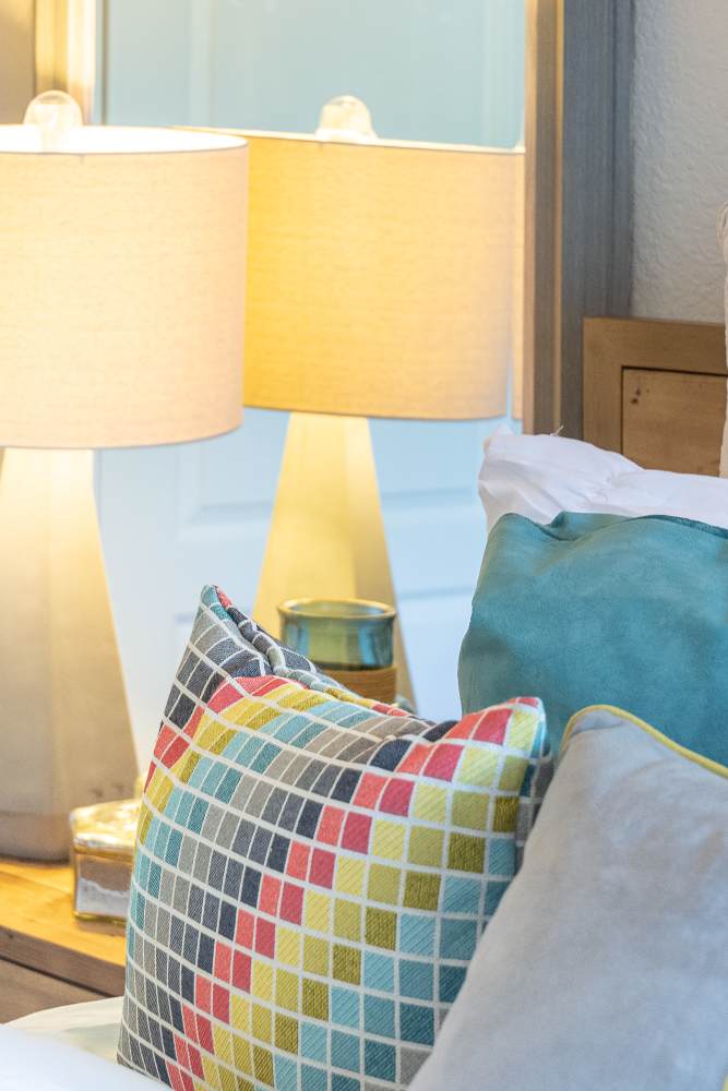 Colorful pillows on a bed at Willow Grove in Modesto, California