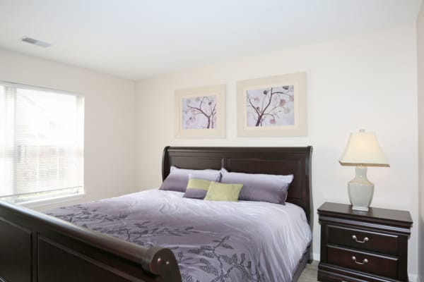 A spacious bedroom at Bennington Hills Apartments in West Henrietta, New York