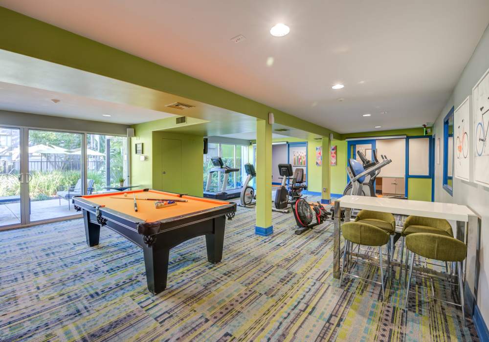 Community indoor games at UCE Apartment Homes in Fullerton, California  