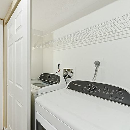 Laundry room with a washer and dryer in a home at Chase Lea Apartment Homes in Owings Mills, Maryland