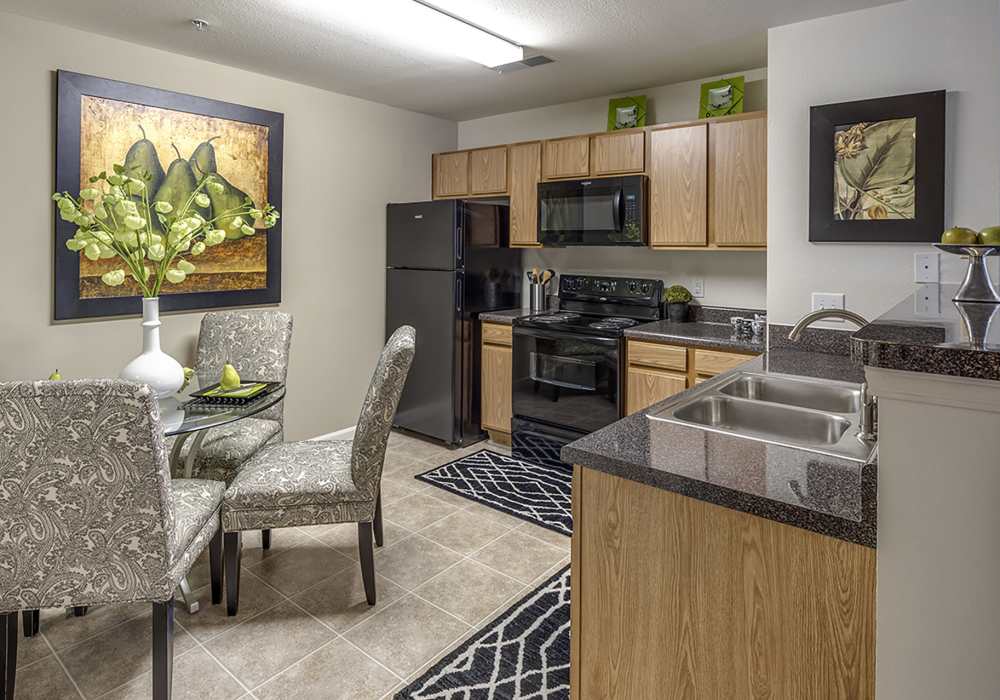Spacious kitchen overlooking the living area at Cedarcrest Village in Lexington, South Carolina