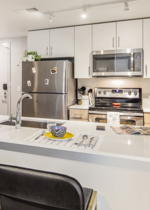 Fully equipped kitchen at RISE at Riverfront Crossings in Iowa City, Iowa