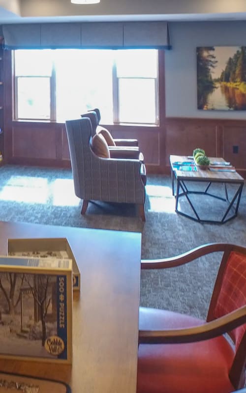 Resident game room with puzzles at The Pillars of Mankato in Mankato, Minnesota
