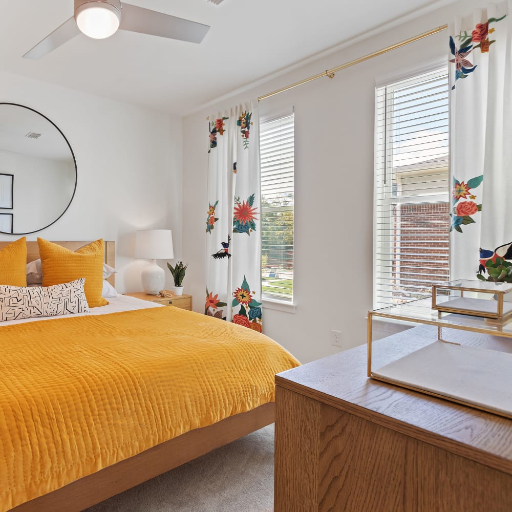 Well-furnished model bedroom in an apartment home at Archer at Brookhill in Charlottesville, Virginia