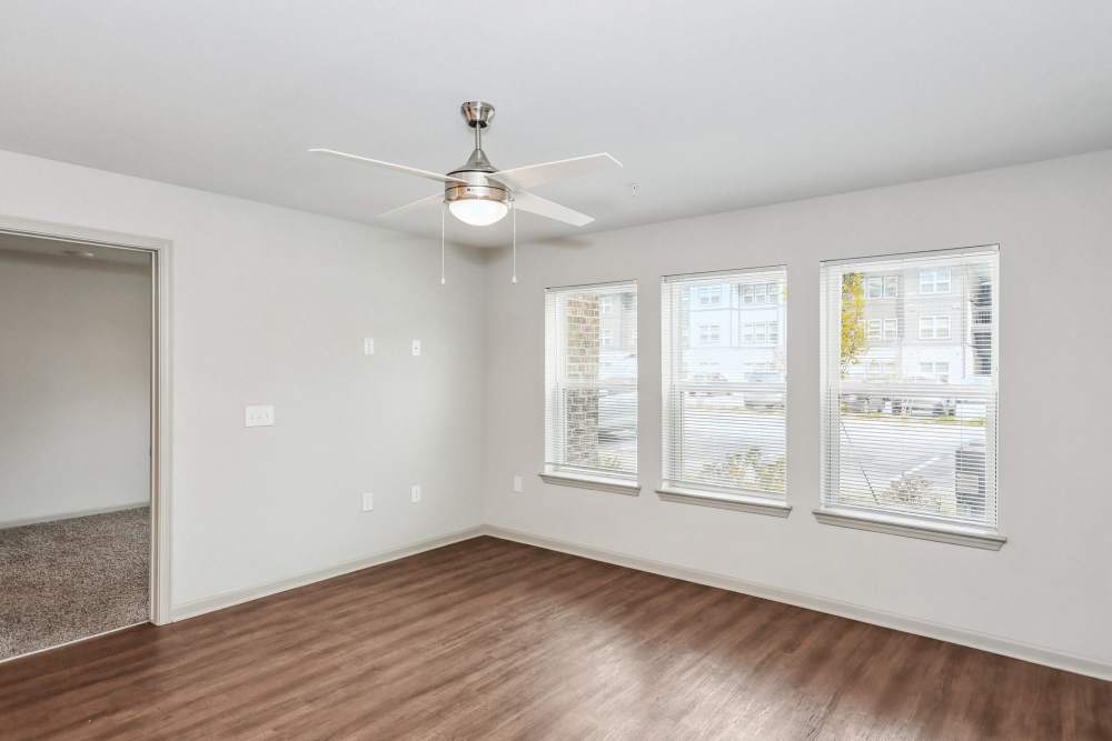 Living room with windows at Flats at Mount Zion in Stockbridge, Georgia
