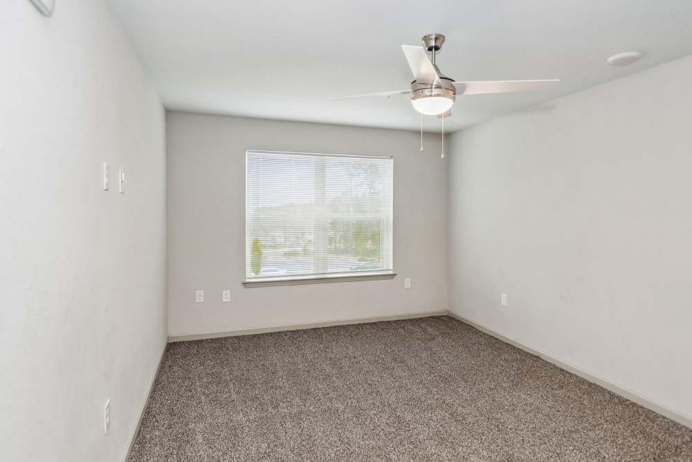 Bedroom with a big window at Flats at Mount Zion in Stockbridge, Georgia