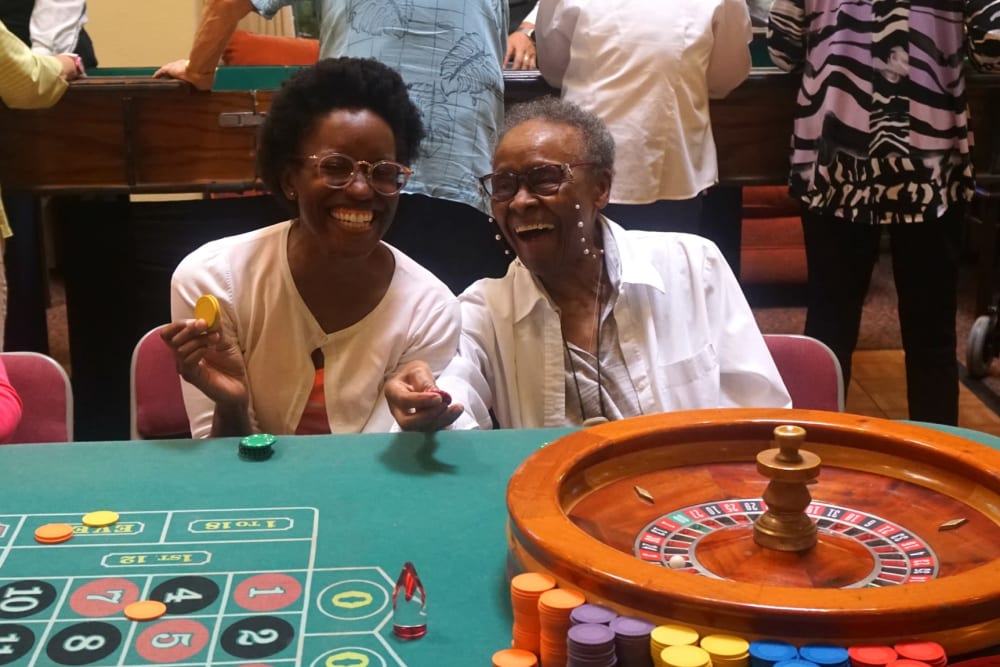 Resudents enjoying fun games on casino night at Winding Commons Senior Living in Carmichael, California