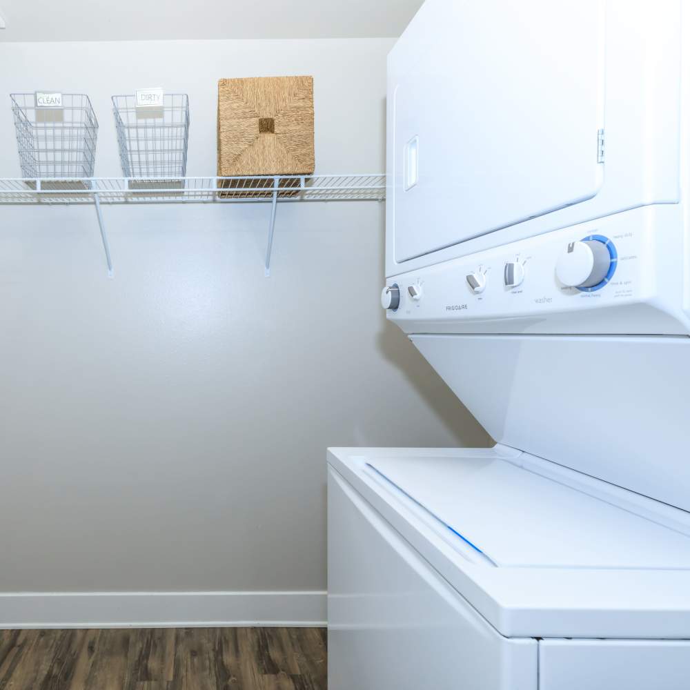 Stoarge area with stackable washer and dryer unit at Park Place Olde Town Apartments in Arvada, Colorado