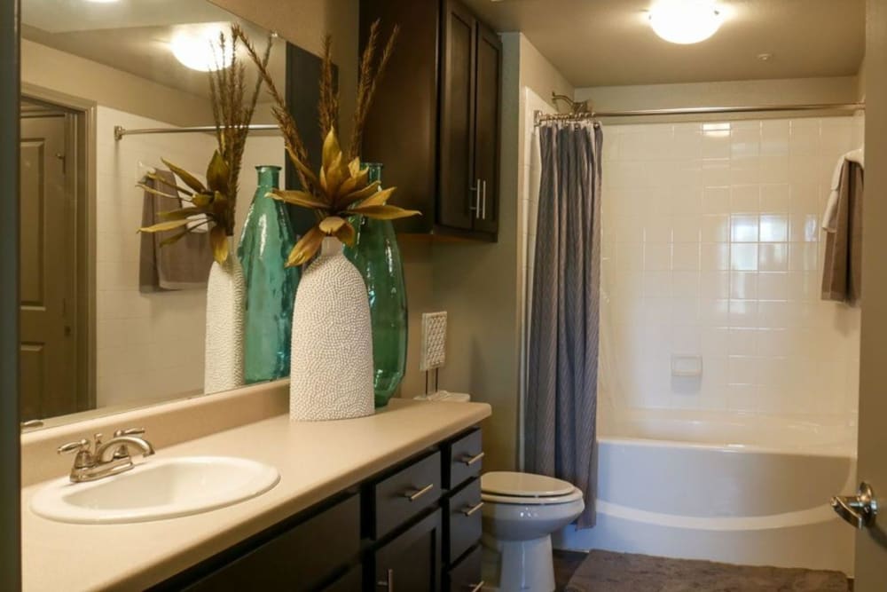 Model bathroom with ample cabinetry at The BLVD in San Angelo, Texas