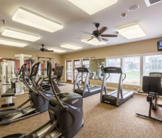 Fully equipped fitness center at Oakmonte Apartments in Webster, New York