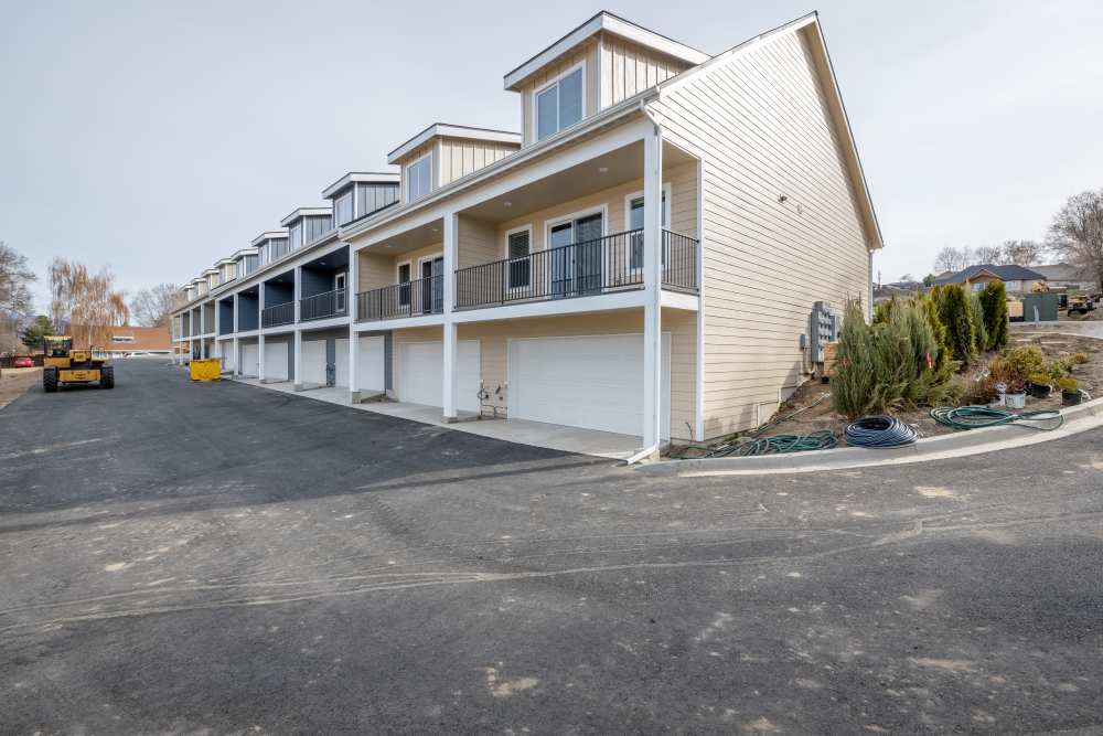 Exterior view of the community with large balcony at 14th Street Townhomes in East Wenatchee, Washington